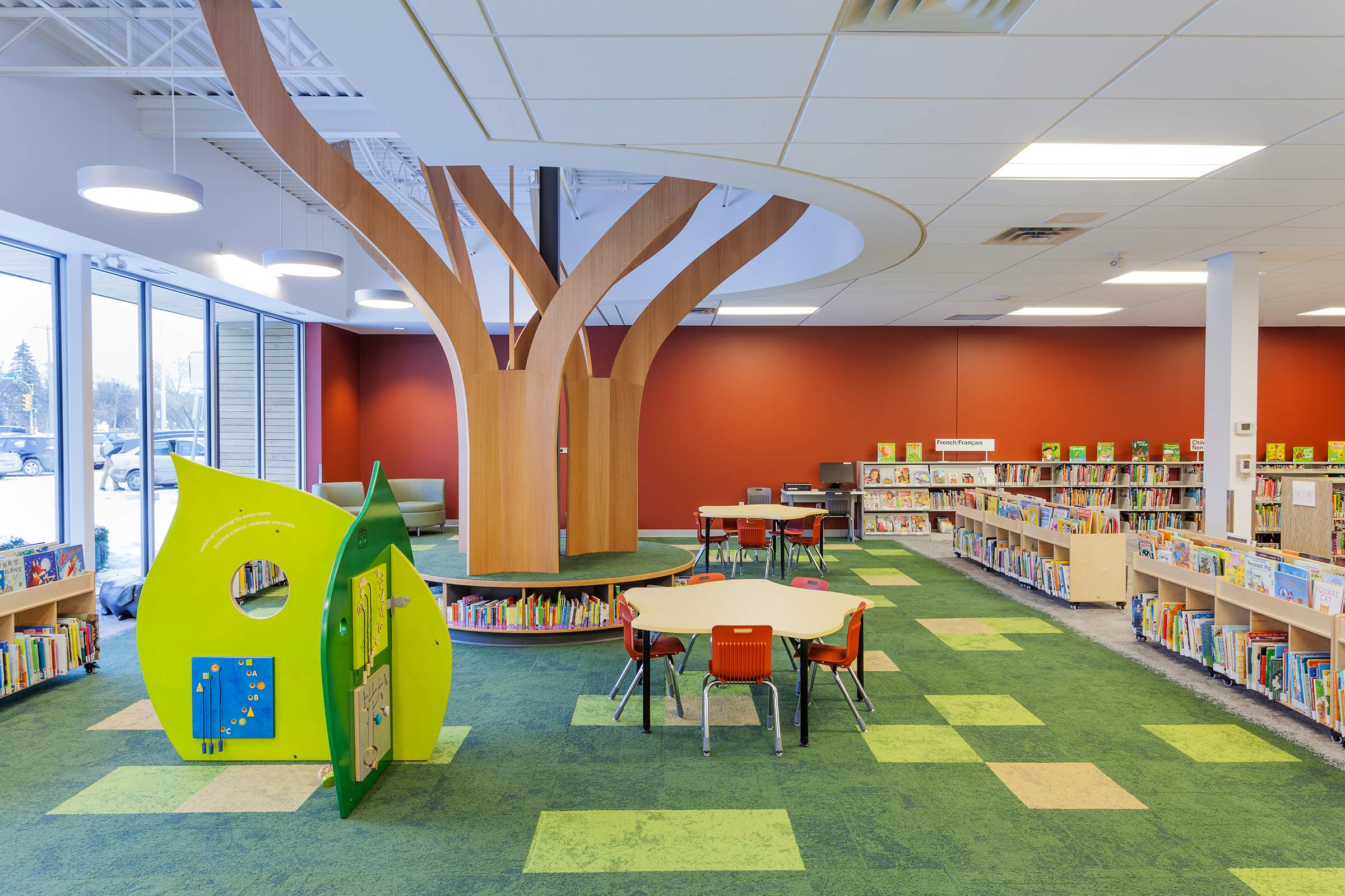 Charleswood Library Children's Area feature a large tree from the floor to ceiling.