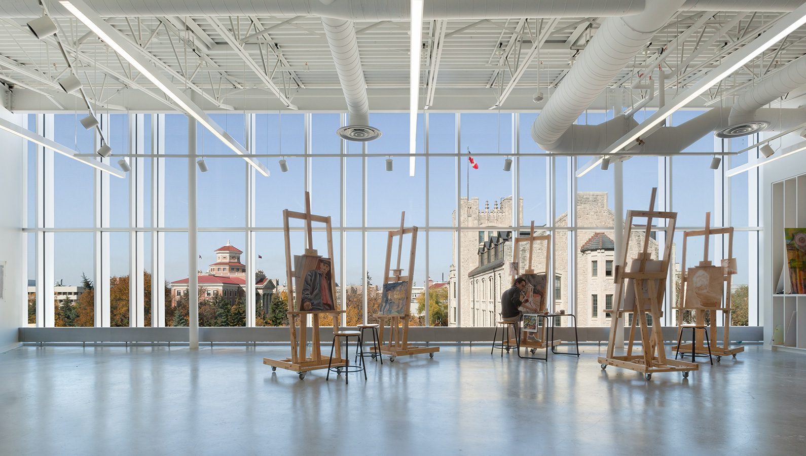 University of Manitoba ARTLab studio space with painting easels overlooking the greater campus.