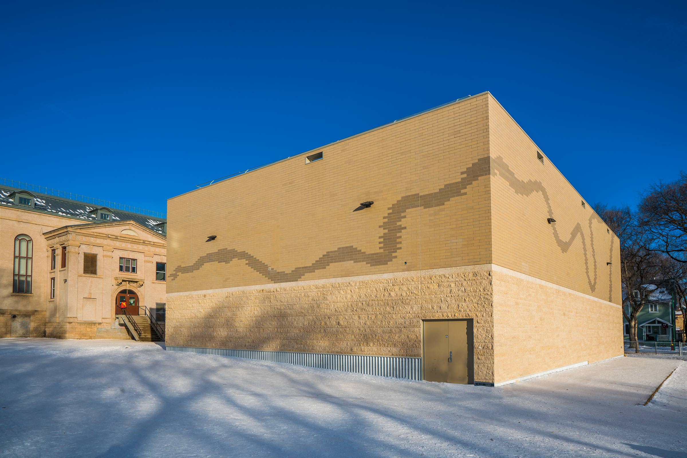 Laura Secord School Gymnasium Addition from the back depicting the local landscape on the building.